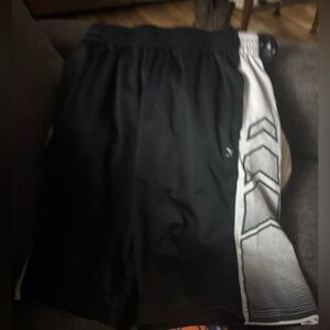 Xersion shorts black with white arrow pieces on sides